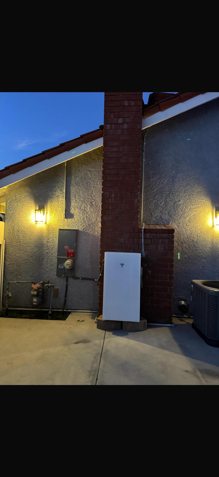 Exterior electrical panel and disconnect prepared for a generator hookup in San Diego